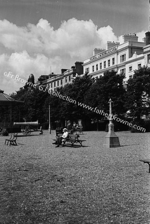 HOTEL COMMODORE ON DAY OF OPENING WITH BANDSTAND AND PARK